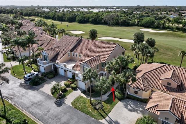 birds eye view of property with golf course view