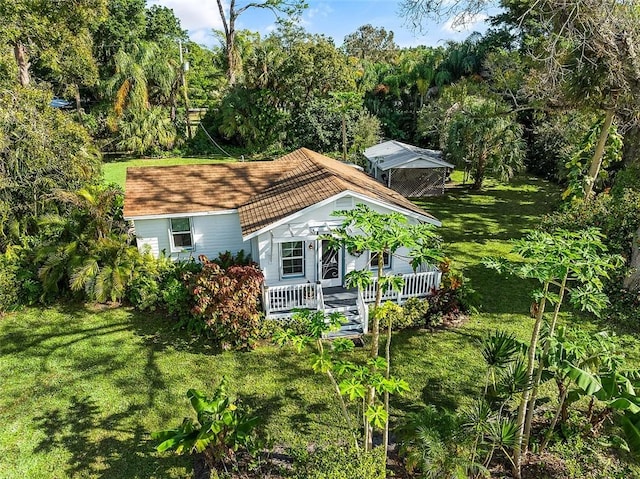 exterior space with a lawn and a porch