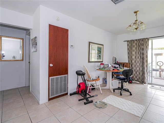 office space featuring a chandelier, light tile patterned floors, and baseboards