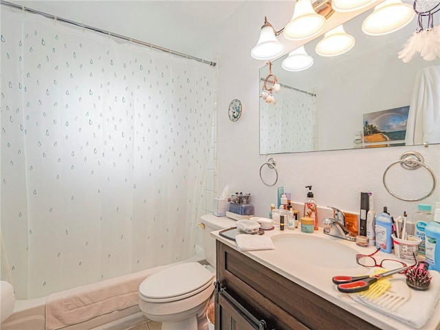 bathroom featuring vanity, toilet, and shower / bath combo