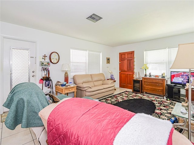 bedroom with light tile patterned flooring
