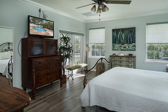 bedroom with crown molding, dark hardwood / wood-style floors, and ceiling fan