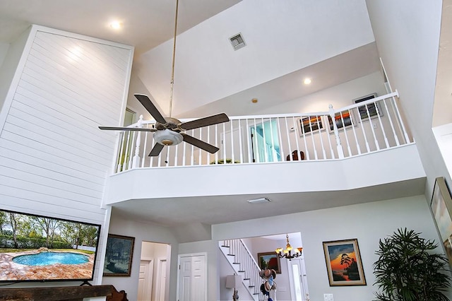 room details with ceiling fan with notable chandelier