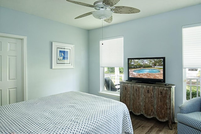 bedroom with ceiling fan and hardwood / wood-style floors