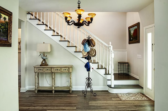 interior space featuring dark wood-type flooring and an inviting chandelier