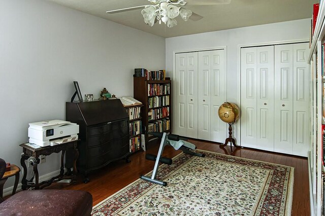 office area featuring ceiling fan and dark hardwood / wood-style flooring