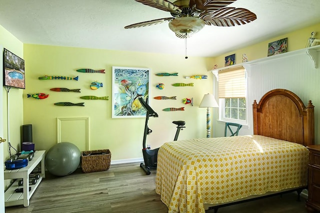 bedroom featuring ceiling fan and hardwood / wood-style floors