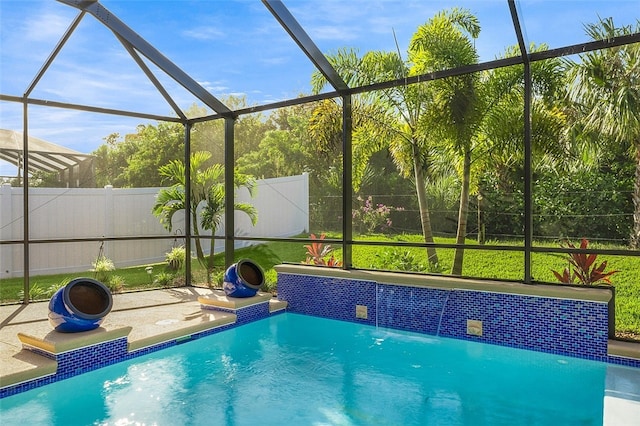 view of pool featuring pool water feature, glass enclosure, and a patio