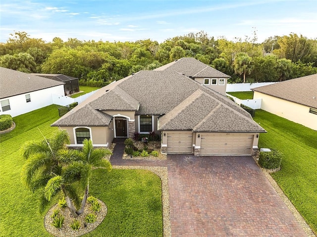 view of front facade with a garage and a front lawn