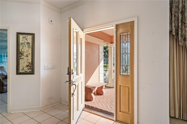 tiled foyer with ornamental molding