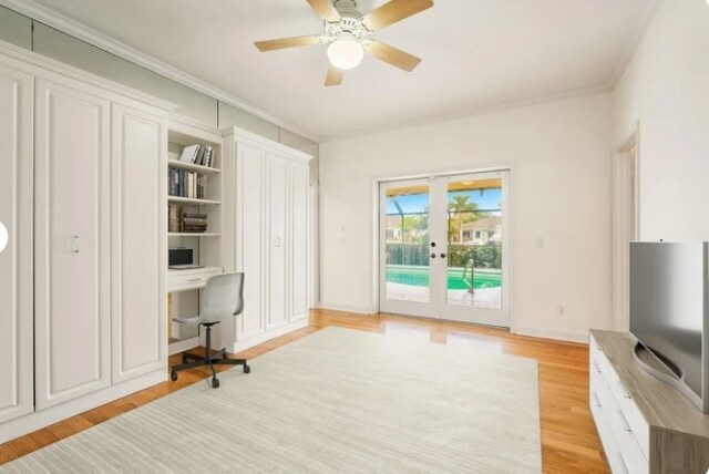 bedroom with ensuite bath, light hardwood / wood-style flooring, and ceiling fan