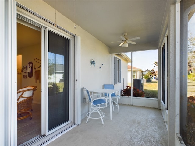 sunroom featuring a wealth of natural light and ceiling fan