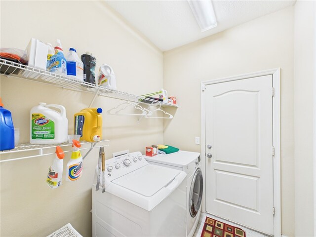 laundry area with washer and dryer and laundry area