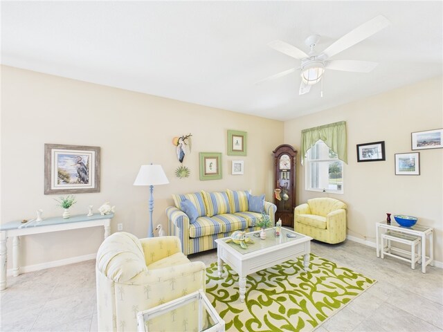 living room featuring ceiling fan and carpet