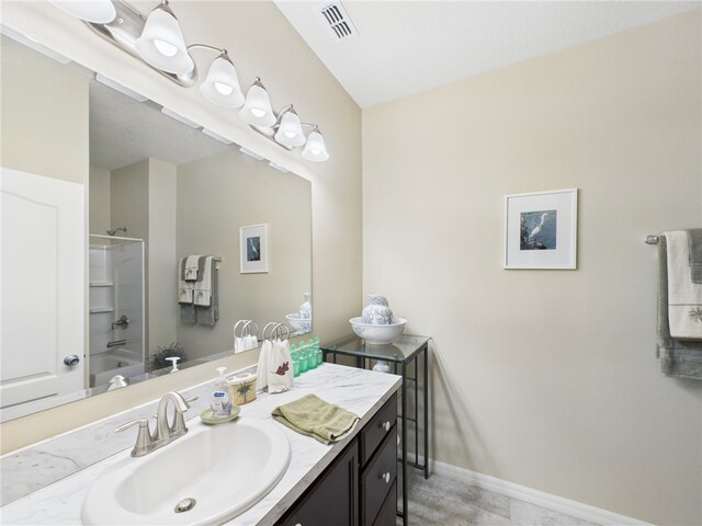 full bathroom featuring visible vents, vanity, shower / bathtub combination, and baseboards