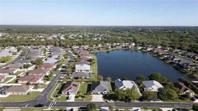 drone / aerial view featuring a residential view and a water view