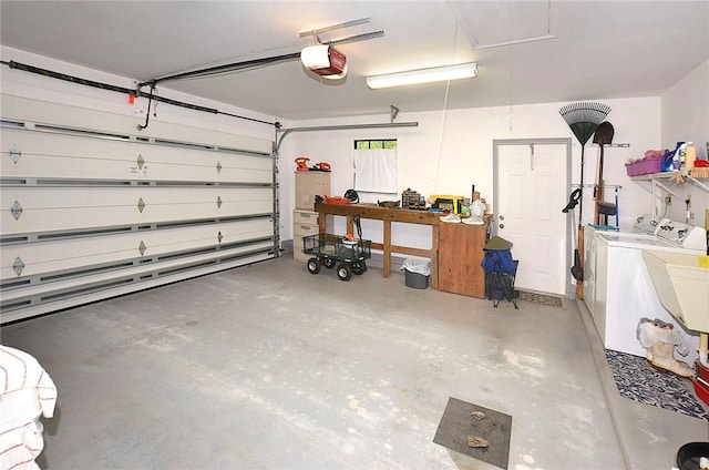 2440 88th Ave, Vero Beach, FL 32966 - garage with washing machine and clothes dryer and a garage door opener