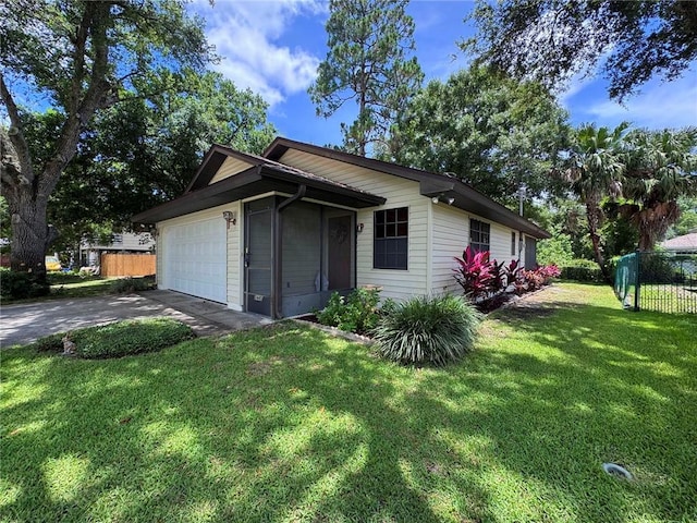 2440 88th Ave, Vero Beach, FL 32966 - view of home's exterior with driveway and an attached garage