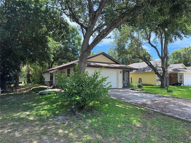 2440 88th Ave, Vero Beach, FL 32966 - ranch-style home featuring concrete driveway, a front yard, and a garage