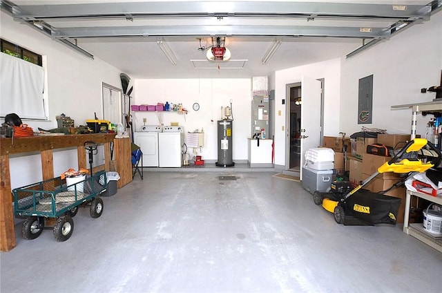 2440 88th Ave, Vero Beach, FL 32966 - garage featuring washer and dryer, water heater, electric panel, a garage door opener, and heating unit