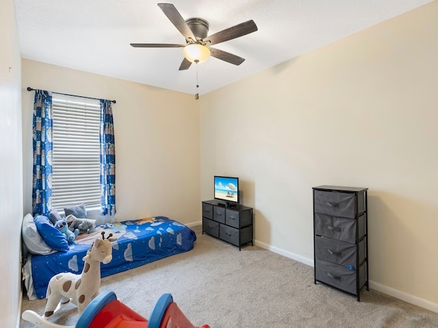 bedroom with ceiling fan and light colored carpet