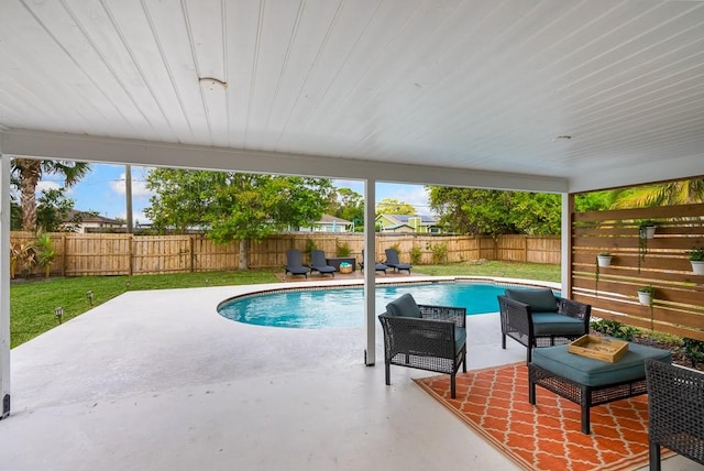 view of swimming pool with a patio, a lawn, a fenced backyard, and a fenced in pool