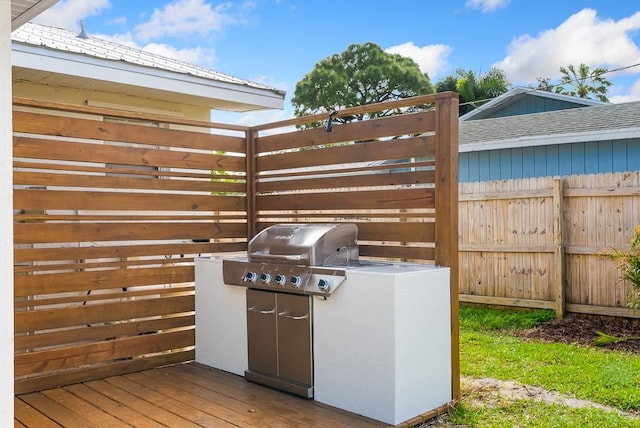 view of patio featuring grilling area and fence