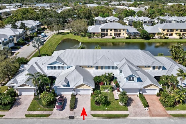 aerial view featuring a residential view and a water view