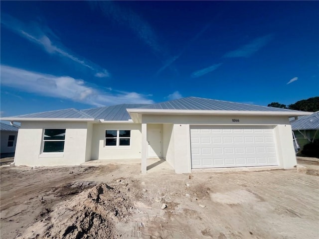 single story home featuring a garage