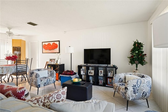 living room with light tile patterned floors and ceiling fan