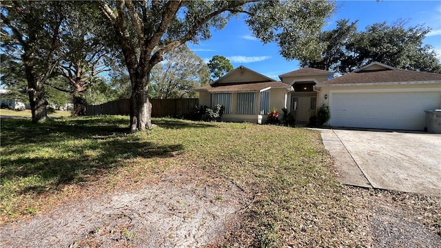 single story home with a front lawn and a garage