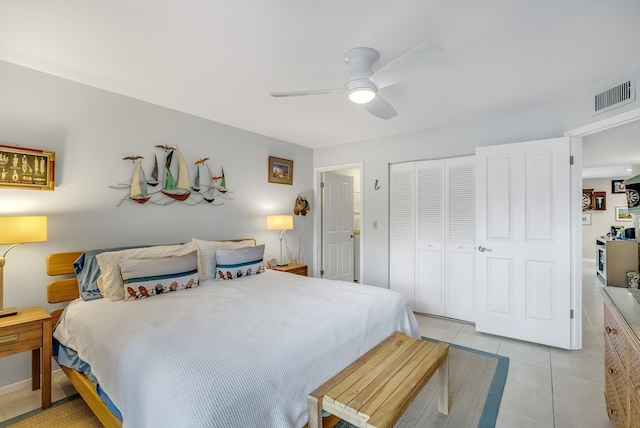 41 Woodland Dr Unit 102, Vero Beach, FL 32962 - bedroom featuring a closet, light tile patterned floors, and ceiling fan
