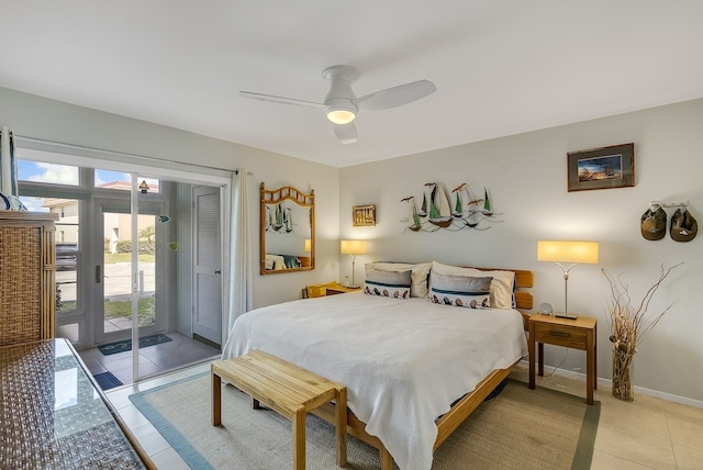 41 Woodland Dr Unit 102, Vero Beach, FL 32962 - bedroom featuring access to outside, light tile patterned floors, a ceiling fan, and baseboards