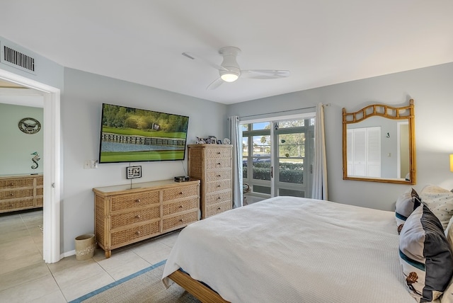 41 Woodland Dr Unit 102, Vero Beach, FL 32962 - tiled bedroom with a ceiling fan and baseboards