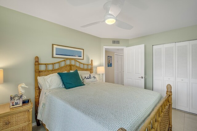 41 Woodland Dr Unit 102, Vero Beach, FL 32962 - bedroom with a closet, a ceiling fan, and light tile patterned flooring