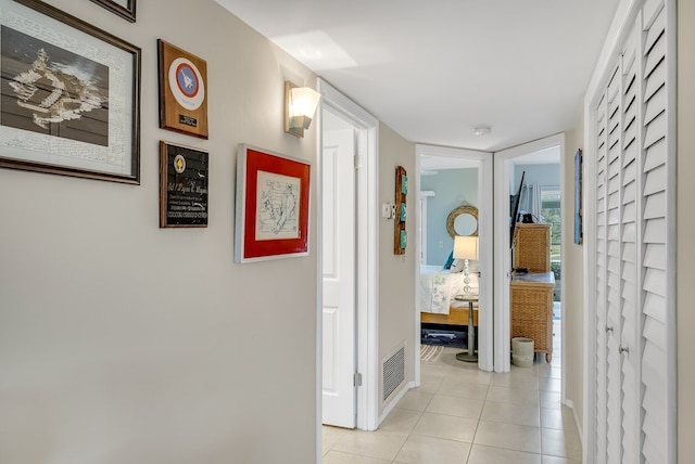 41 Woodland Dr Unit 102, Vero Beach, FL 32962 - corridor with light tile patterned flooring and baseboards