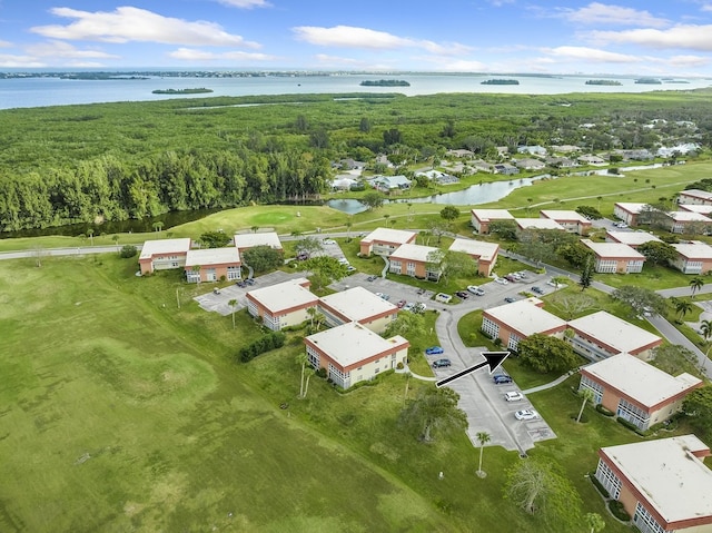 41 Woodland Dr Unit 102, Vero Beach, FL 32962 - drone / aerial view of a large body of water and a golf club