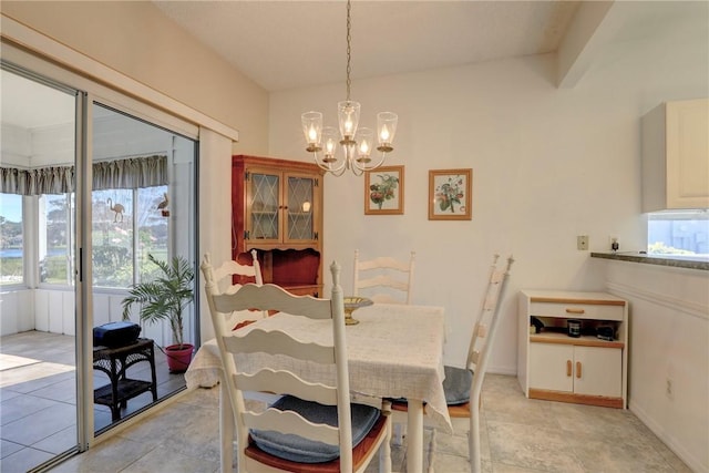 dining area featuring a chandelier