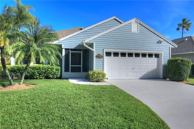 view of front facade with a garage and a front yard