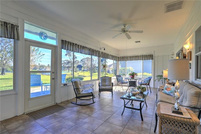 sunroom featuring ceiling fan