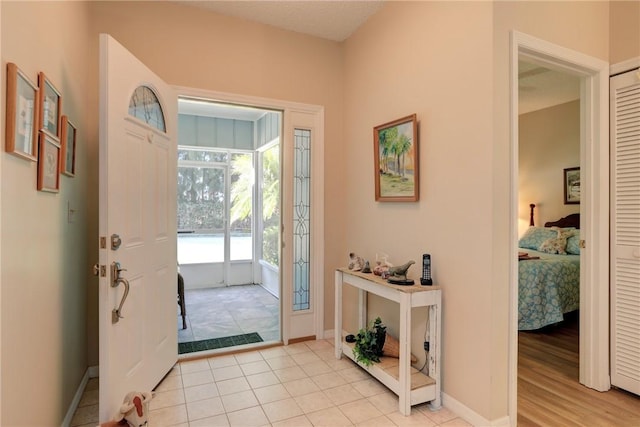 foyer entrance featuring light tile patterned floors