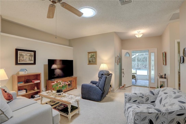 living room with light carpet, a textured ceiling, and ceiling fan