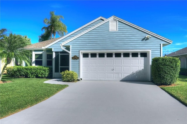 1790 Tamarind Pl, Vero Beach, FL 32962 - ranch-style home featuring concrete driveway, an attached garage, and a front lawn