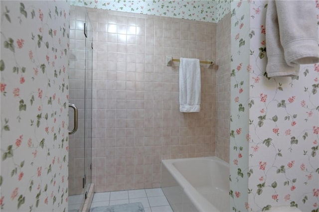 bathroom featuring tile patterned flooring and separate shower and tub