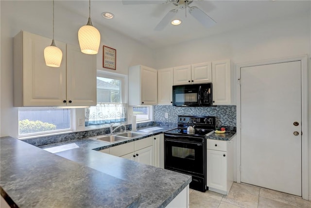 kitchen with sink, white cabinets, black appliances, and decorative light fixtures