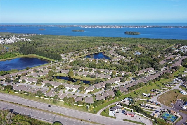 birds eye view of property with a water view