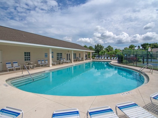 view of swimming pool with a patio area