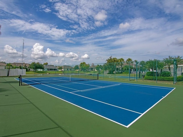 view of tennis court featuring basketball court