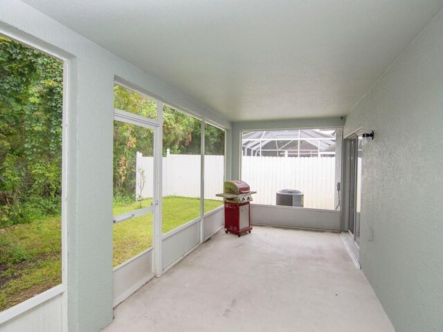 unfurnished sunroom with plenty of natural light