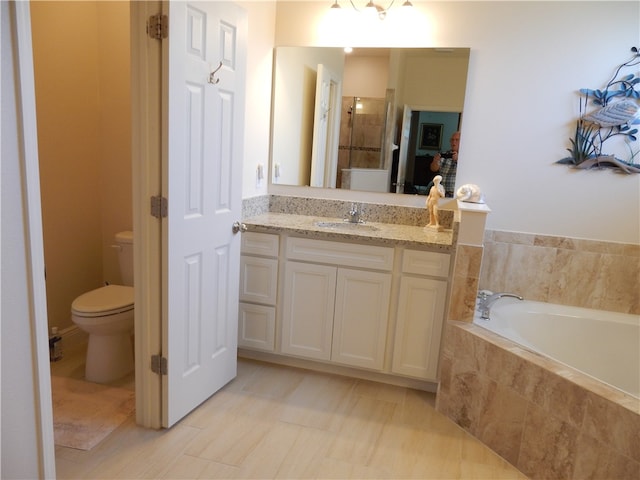 full bathroom featuring vanity, toilet, and independent shower and bath